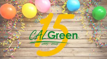 The CALGreen logo over the number 15 on a wood background with balloons